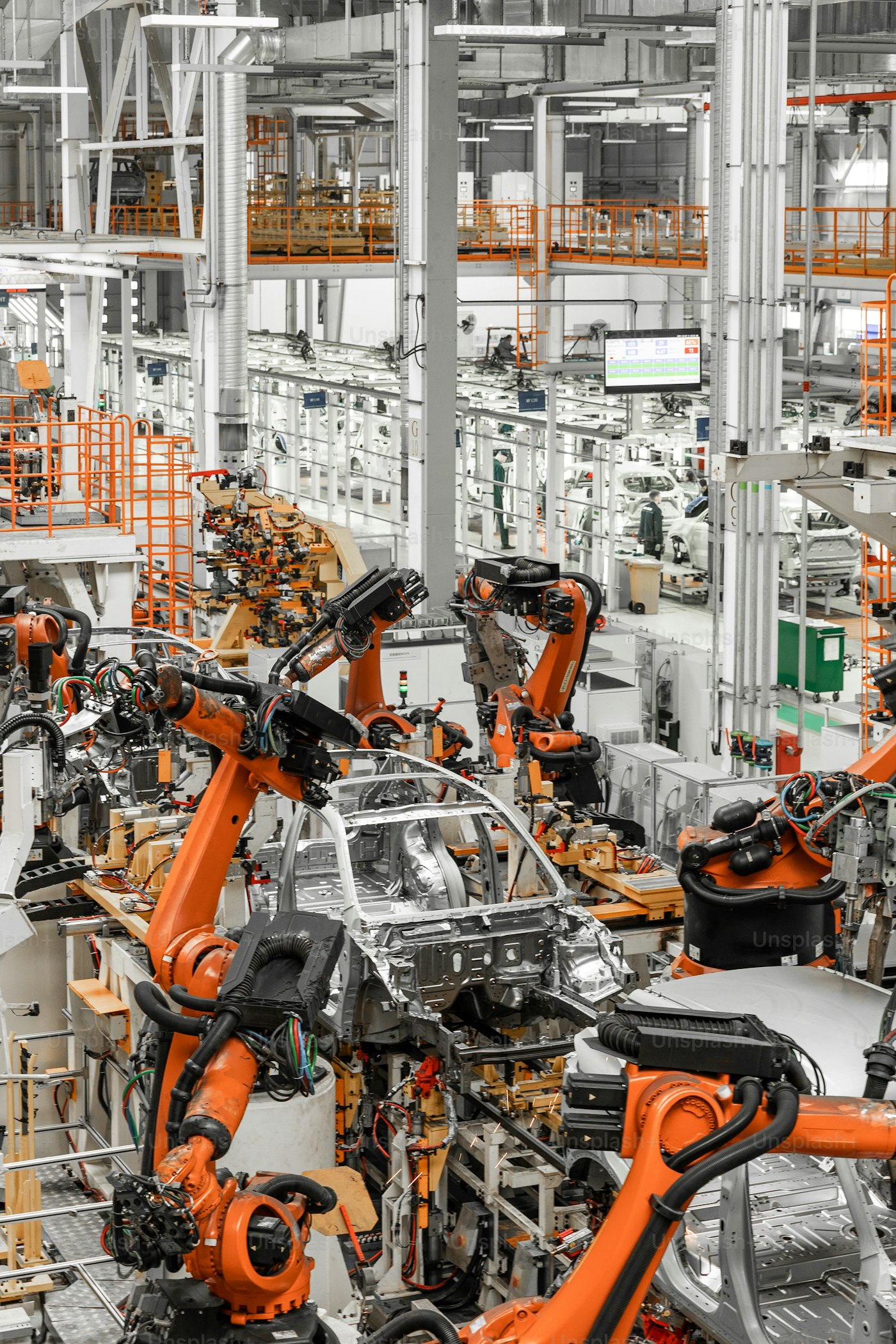 Industrial worker inspecting a production line in a modern factory